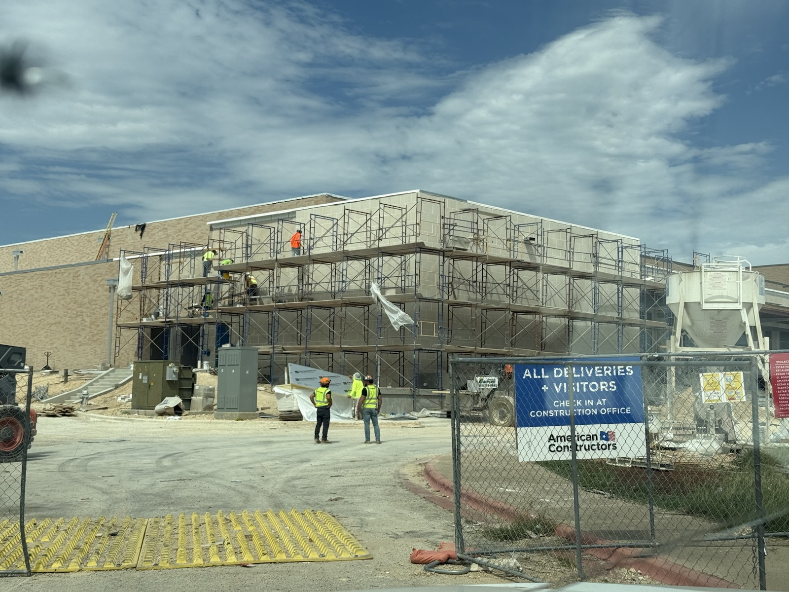 Angel’s masonry project with block walls and scaffolding during commercial construction